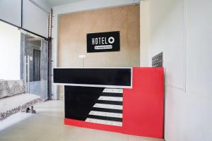 a red and black counter in a room at Hotel O Wardha Road Near Airport in Nagpur