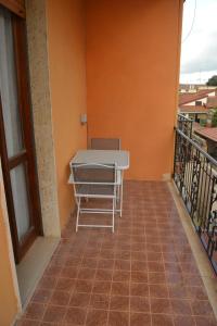 a table on the balcony of a building at The Domus in Olmedo