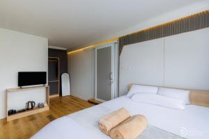 Ένα ή περισσότερα κρεβάτια σε δωμάτιο στο Fortune Cube