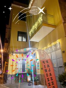 a building with a sign in front of it at Sky and Green Luxury Apartament in Boscoreale