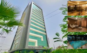 Un edificio alto con piscina y una casa. en Blue Moon Hotel, en Erbil