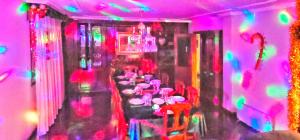 a pink room with a long table with pink chairs at Villagalicia360 in Bergondo +52 photos