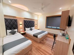 Voodi või voodid majutusasutuse Hotel Riza - Near Nesco Exhibition Centre toas