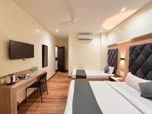 Televiisor ja/või meelelahutuskeskus majutusasutuses Hotel Riza - Near Nesco Exhibition Centre