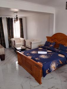 Ένα ή περισσότερα κρεβάτια σε δωμάτιο στο Julli Villas