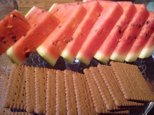 a plate with crackers and slices of watermelon at Willa Pod Aniołem in Szczyrk