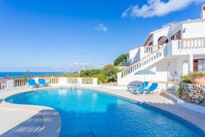 a swimming pool in front of a villa at V60A Villa Lucia in Son Bou
