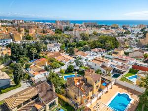 an aerial view of a city with houses and the ocean at Casa de los Limones by Michael FAMILY VILLA NEAR PUERTO MARINA in Benalmádena