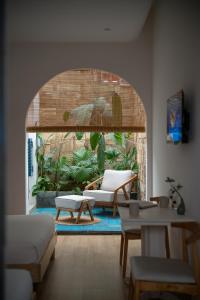 a living room with a couch and a table at MOONLIGHT Homestay & Hotel in Pleiku