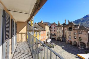 a view from an apartment balcony of a city street at Piazza Mercato14 in Domodossola
