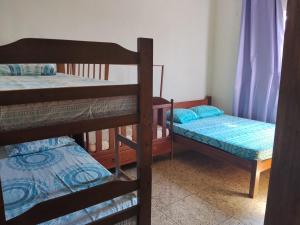 a room with three bunk beds in a room at Rancho Fazenda Vista Alegre in Capitólio +43 photos