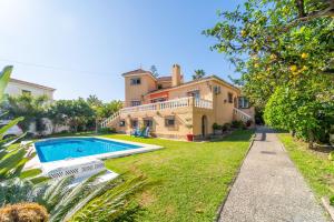an estate with a swimming pool in front of a house at Casa de los Limones by Michael FAMILY VILLA NEAR PUERTO MARINA in Benalmádena