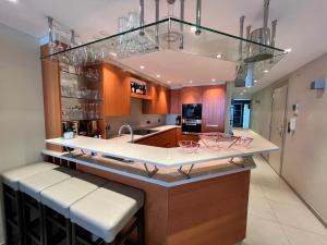 a kitchen with a large island with a counter top at BEL AIR HOLIDAY - 3 Bedroom Apartment with Sauna and Phenomenal Sea View T72 in Ostend