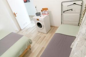 Postel nebo postele na pokoji v ubytování Séjourner chez Roto