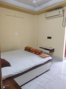 a bedroom with a bed in a room at Hotel Star, Agartala in Agartala