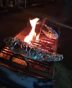 a grill with a hot dog on top of it at Ayurveda Villa Rob Roy in Beruwala