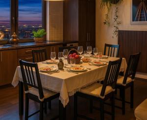 a table with wine glasses and food on it at Bellevue Beam House in Covasna +37 photos