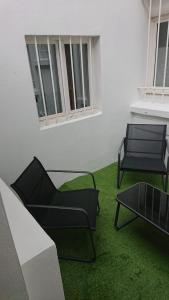 Et opholdsområde på Plein centre Cosy 38m2 avec accès terrasse, spa et sauna communs Place Dalton