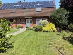 a house with solar panels on the roof at Apartment in Seevetal in Seevetal
