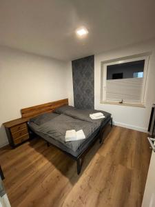 a bedroom with a bed and a window at Apartment in Seevetal in Seevetal