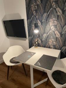 a white desk with a computer on top of it at Apartment in Seevetal in Seevetal