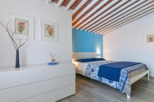 Giường trong phòng chung tại Appartamento Tosca