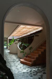 an entrance to a building with stairs and plants at MOONLIGHT Homestay & Hotel in Pleiku