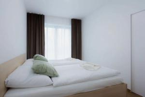 Ένα ή περισσότερα κρεβάτια σε δωμάτιο στο Lebenski Residence Tatras Exclusive Apartment