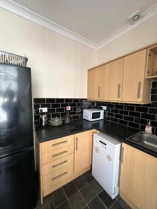 Kuchyň nebo kuchyňský kout v ubytování Central Retreat on Sauchiehall Street