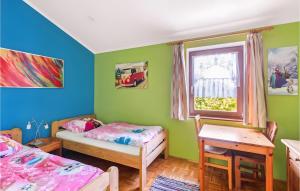 En eller flere senge i et værelse på Ferienhaus Natur pur