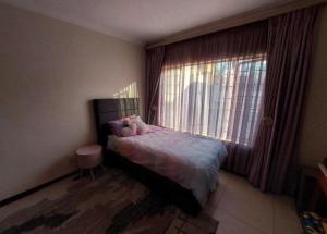 Postel nebo postele na pokoji v ubytování Comfort Luxury Villa Pretoria