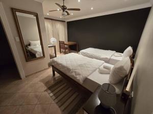 Ένα ή περισσότερα κρεβάτια σε δωμάτιο στο Vogelsang Guesthouse