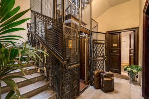 an entrance to a house with stairs and plants at The Club Navona in Rome