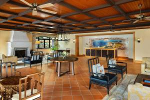 a living room filled with furniture and a fireplace at Pine Cliffs Residence, a Luxury Collection Resort, Algarve in Albufeira