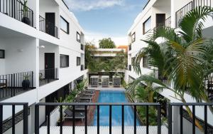 a view from the balcony of a building with a swimming pool at The Calm Oasis in Siem Reap