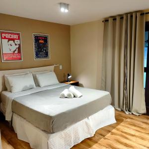 En eller flere senge i et værelse på Casa Cavalo Marinho - Superconfortável! Perto de tudo, longe do tumulto.