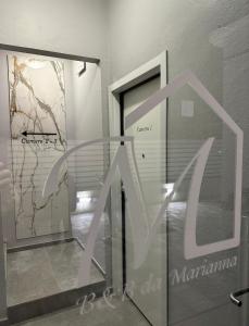 a glass door with a sign in front of it at Da Marianna in Castelnuovo Rangone