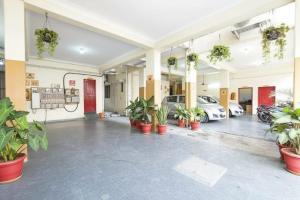 an empty parking lot with cars in a building at Inn34 By Blessings Hospitality - Porur Near DLF in Chennai