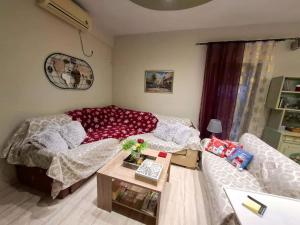 a living room with a couch and a table at Eretria Panorama Seaview Retreat with Balcony in Eretria