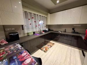 a kitchen with a view of a counter top with a counter top at Eretria Panorama Seaview Retreat with Balcony in Eretria