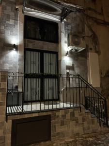 a balcony with a gate on a building at La 75 Stella Home Catania in Catania