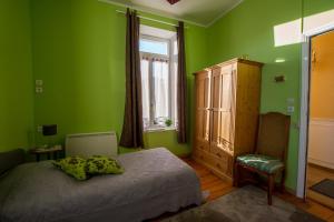 Postel nebo postele na pokoji v ubytování Gites Chateau Comblanchien