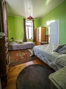 Postel nebo postele na pokoji v ubytování Gites Chateau Comblanchien