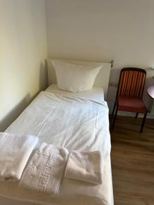 Ένα ή περισσότερα κρεβάτια σε δωμάτιο στο Hotel Aqua