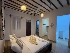 Postel nebo postele na pokoji v ubytování 1Zi hotel and beach club