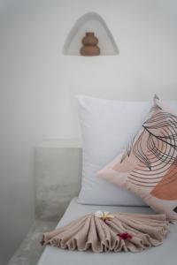 a bed with two pillows and a blanket on it at Furaha Villa Zanzibar in Kiwengwa