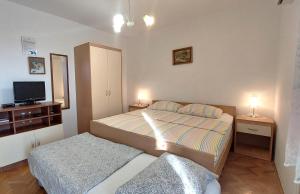 Postel nebo postele na pokoji v ubytování Apartments Dara