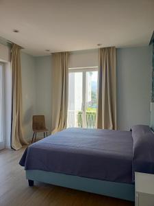 En eller flere senge i et værelse på Casa di Lula