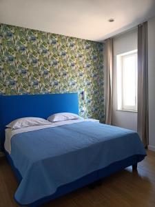 En eller flere senge i et værelse på Casa di Lula + 21 billeder