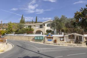 a house on the side of a street at Rhodia Villa in Ayios Isidhoros